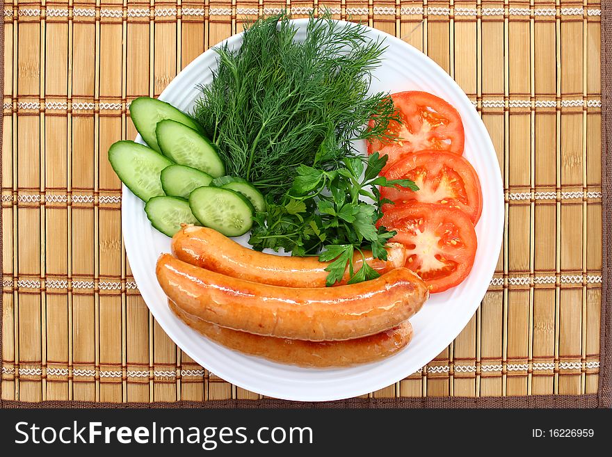 Diner.Delicious vegetable with sausages. Diner.Delicious vegetable with sausages.