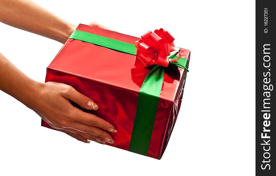 Small red present in woman's hands. Isolated on white background. Small red present in woman's hands. Isolated on white background