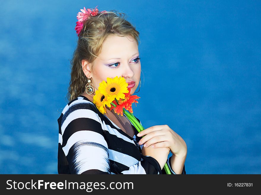 Beautiful woman with flowers in the sea. Beautiful woman with flowers in the sea