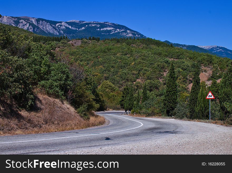 Crimean mountain road on a clear day in summer. Crimean mountain road on a clear day in summer