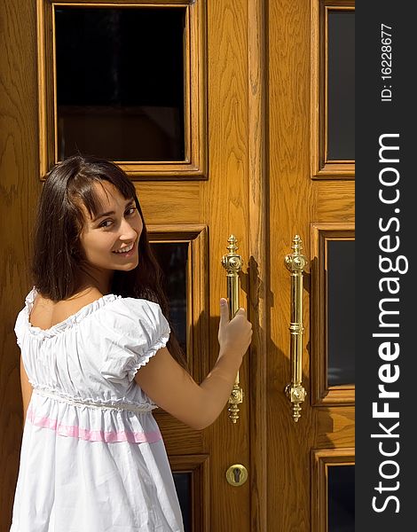 Young Attractive Girl At The Door