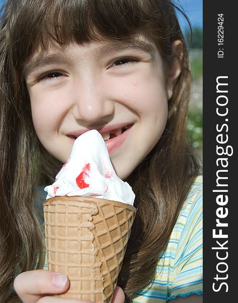 Smiling girl with big cone ice-cream