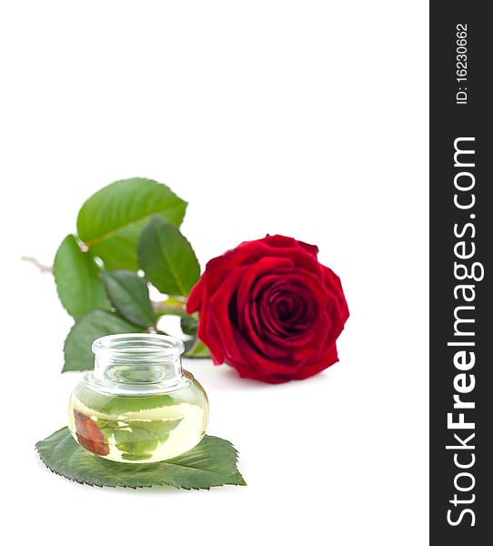 Rose oil in bottle isolated on white. Rose oil in bottle isolated on white