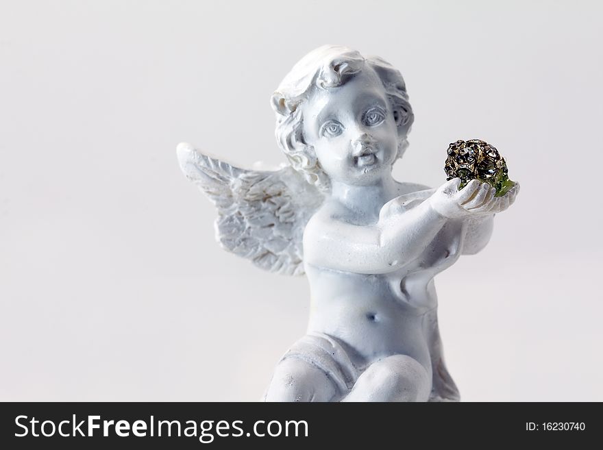 The small figurine of an angel photographed close up