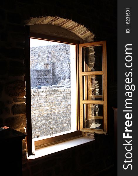 Old stone wall behind an ancient window.