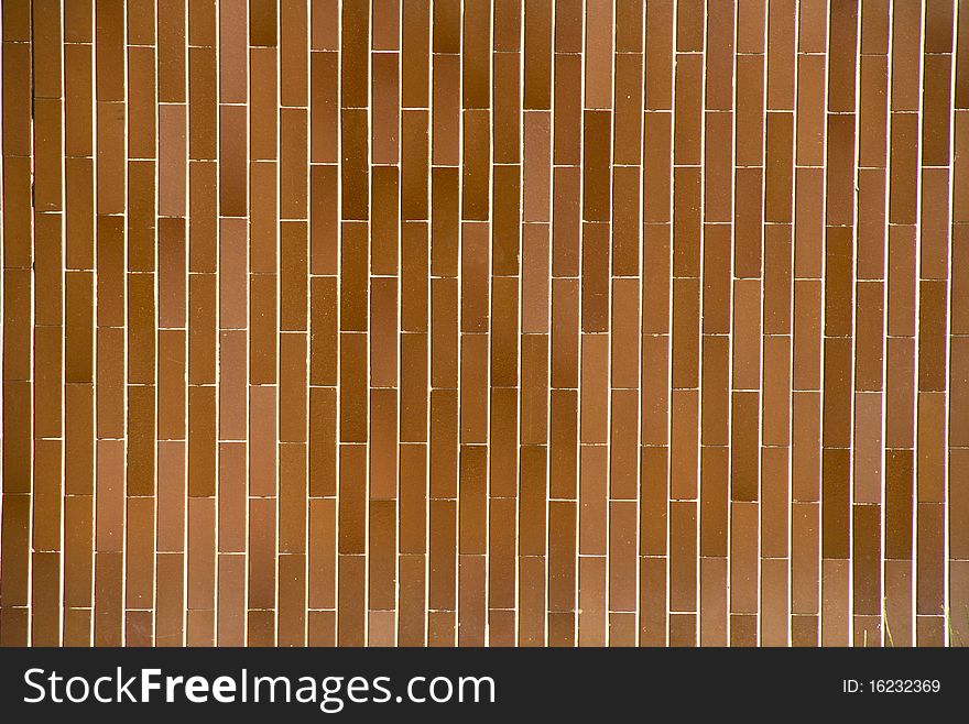 Abstract background made up of brown tiles