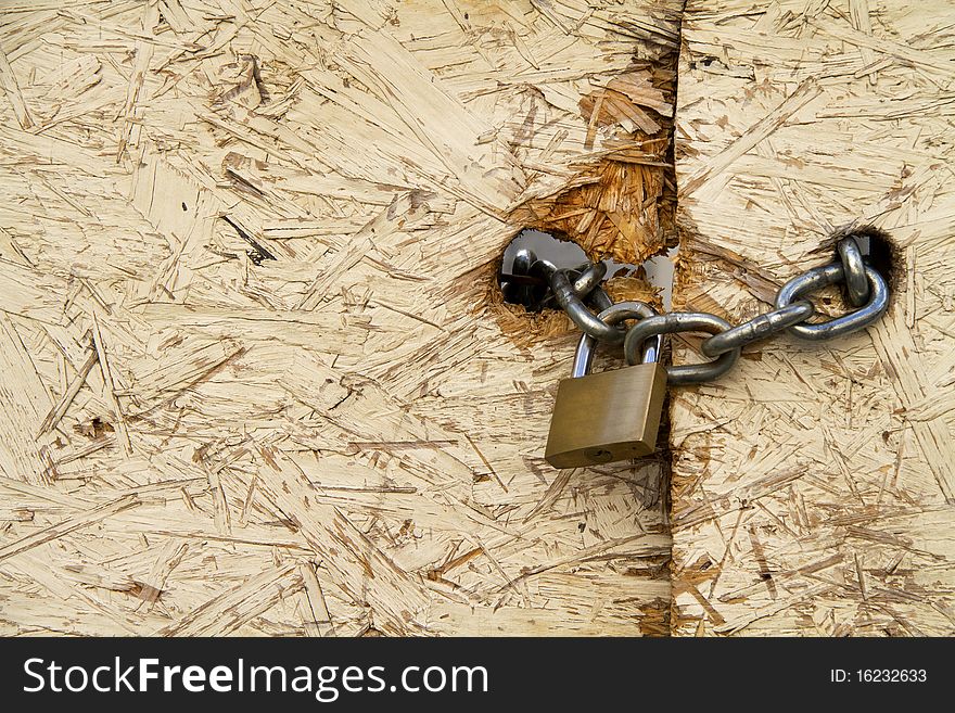 Padlock and chain to close a door