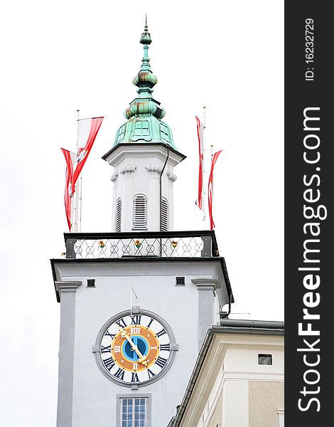 Church clock in Austria isolated with Austrian flags