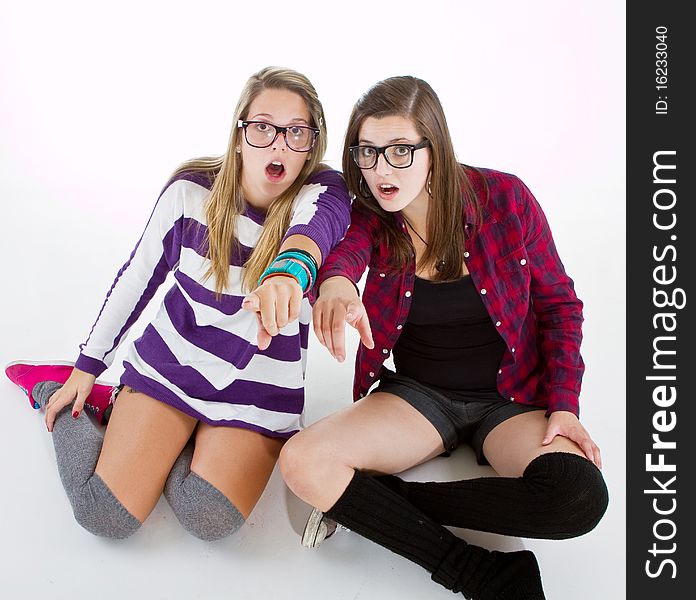 Young trendy teenagers in a nerd / geek style. Isolated over white background. Young trendy teenagers in a nerd / geek style. Isolated over white background.