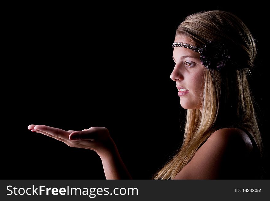 Teenage girl presenting with her hand. Isolated over one colored background.