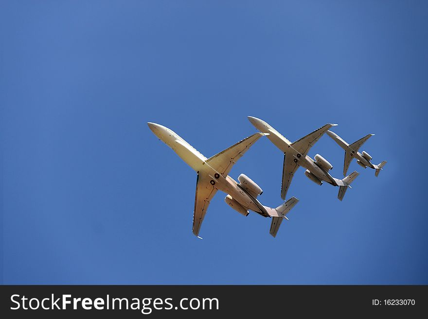 Three aircrafts under a clear blue sky. Three aircrafts under a clear blue sky