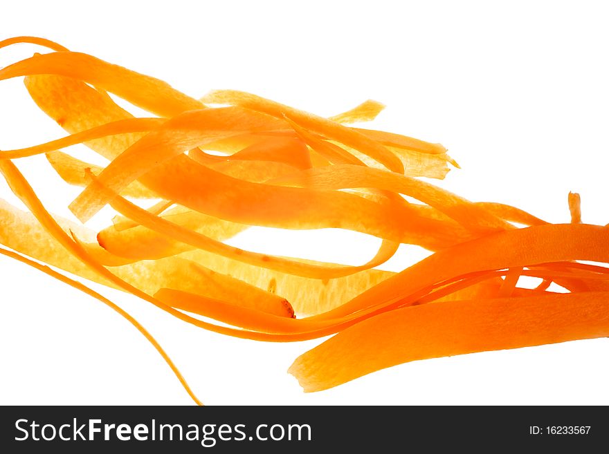 Thin sliced carrots. Taken against the light. Location chaotic. Isolated on white background.