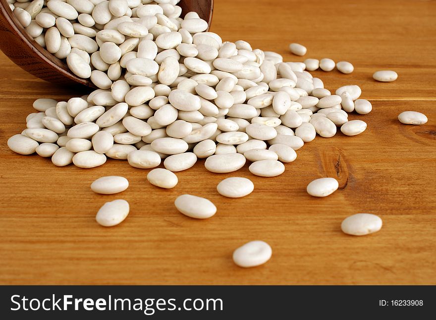 A lot of white dried raw beans for cooking. A lot of white dried raw beans for cooking