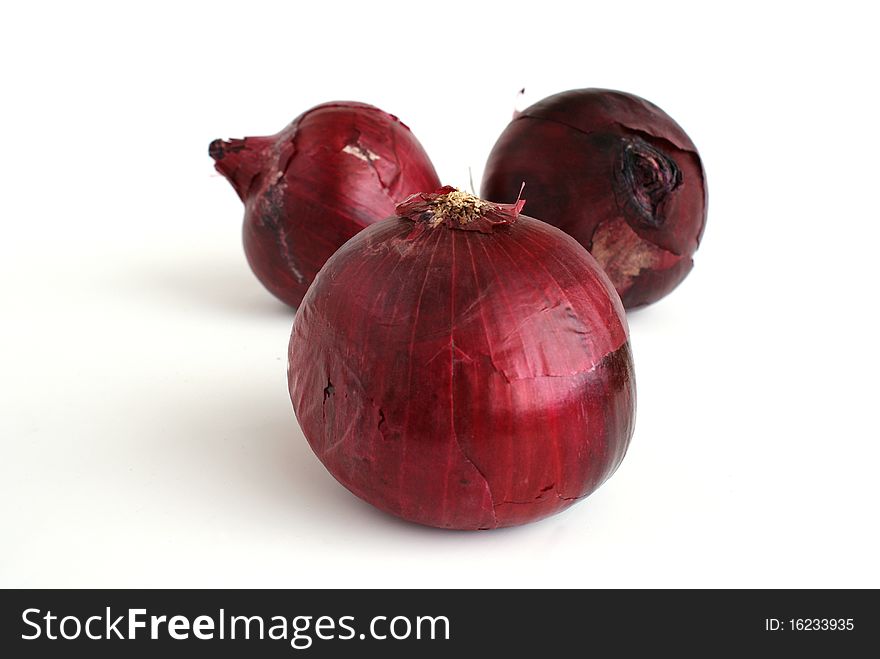 Two red onions (also called purple onions) isolated on plain white background.