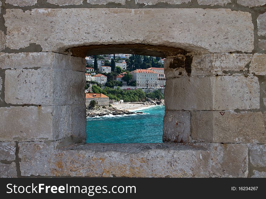 View of Dubrovnik, through hole in the castle walls