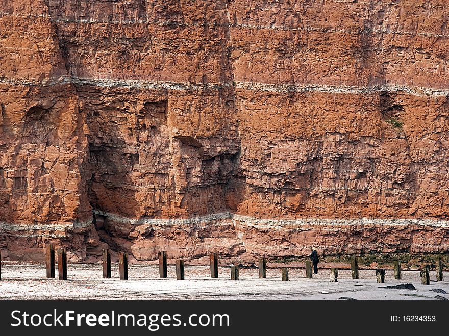 Beach, sand and red cliff