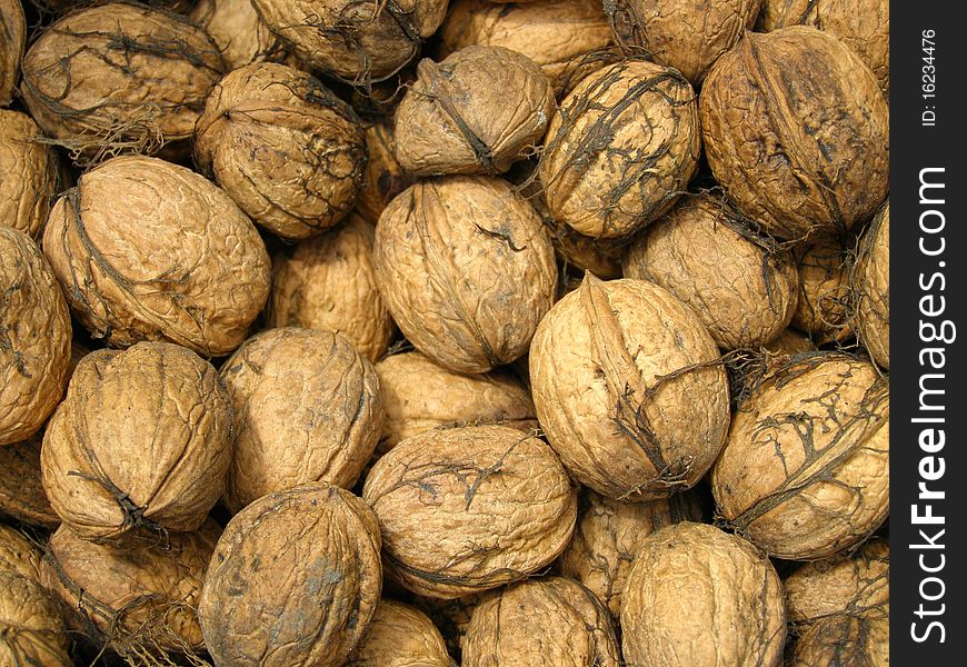 Detail photo texture of the walnuts background. Detail photo texture of the walnuts background