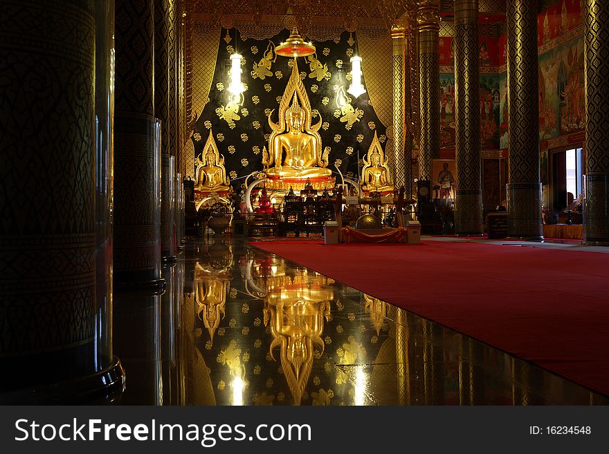 Reflection of a golden beautiful Buddha