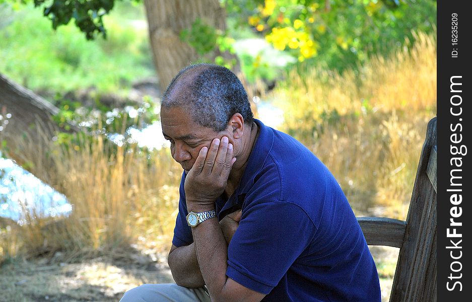 Expressions of an african american male relaxing outdoors. Expressions of an african american male relaxing outdoors.