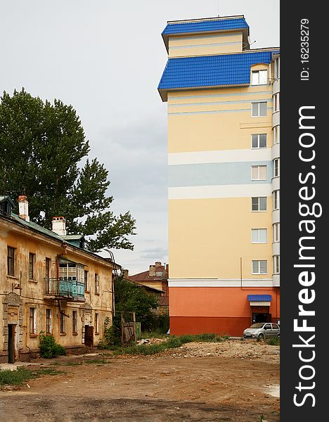 Old house and new modern building. Urban Scene. Old house and new modern building. Urban Scene