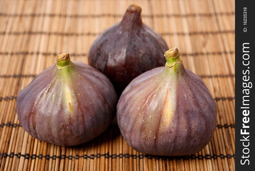 Ripe figs on rural background