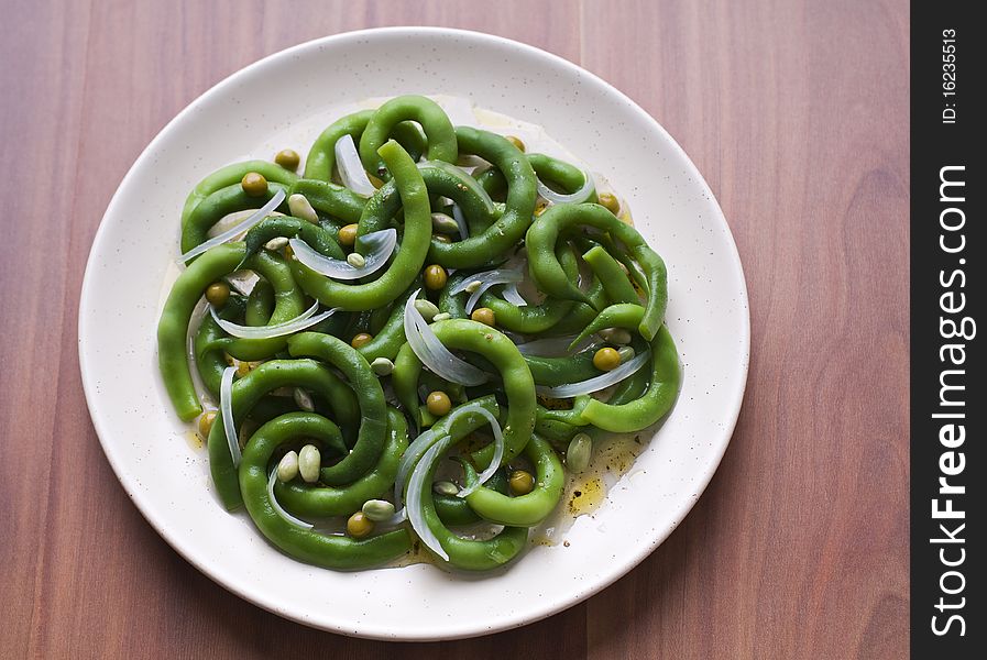 Fresh green bean salad with onion and vinegar close up