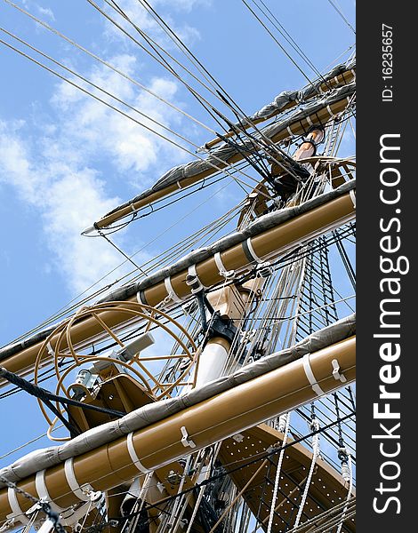 Masts of a tall Ship and cloudy blue sky. Masts of a tall Ship and cloudy blue sky