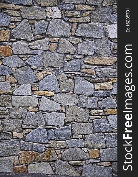 This image shows a wall built with stones. This image shows a wall built with stones