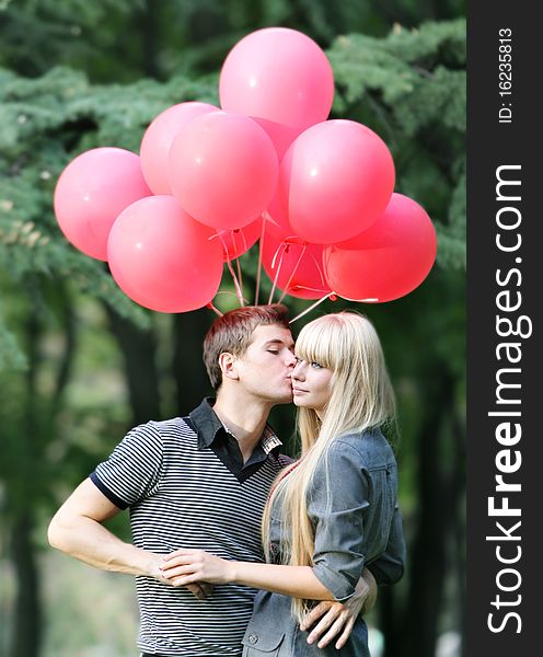 Young loving couple on natural background. Young loving couple on natural background