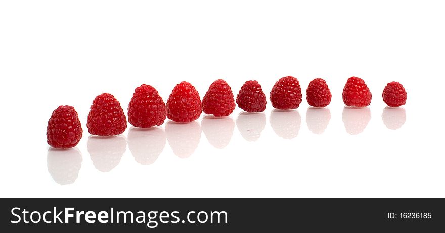 Red raspberry with reflection isolated on white