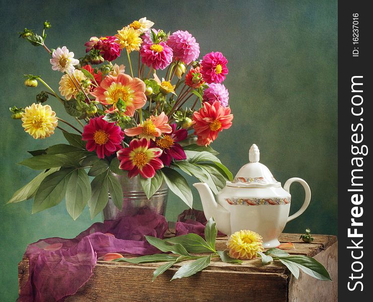 Colored dahlia bouquet and tea
