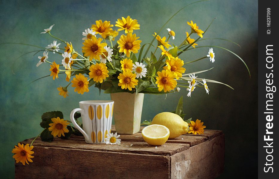 Still life with flower and lemon tea