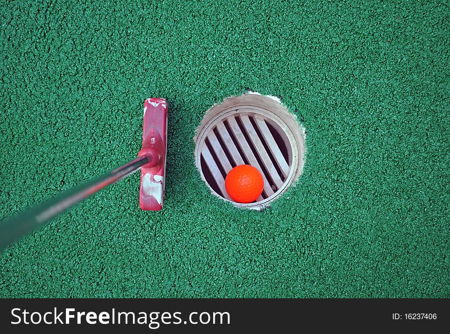 Miniature Golf Ball In The Hole