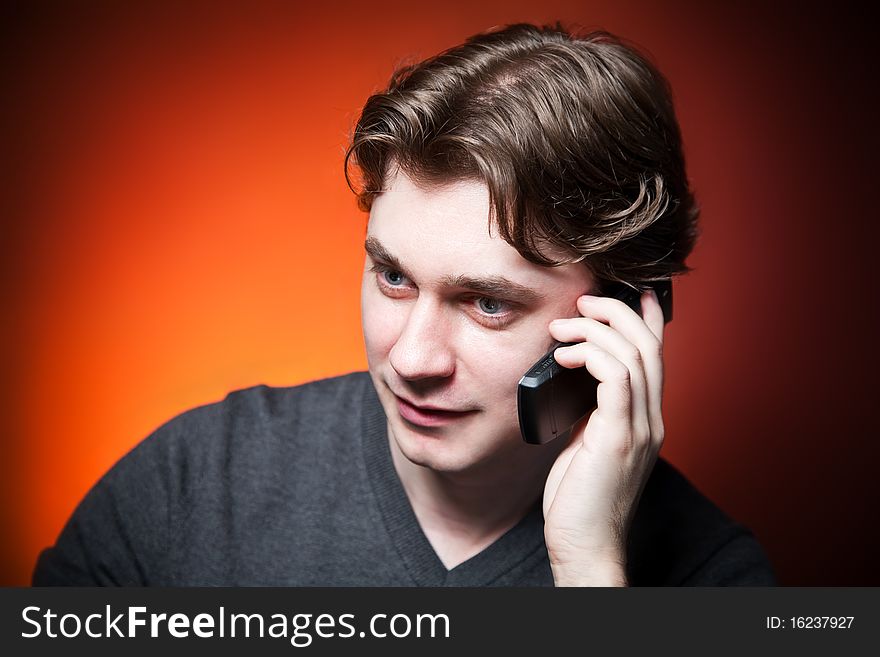 Young man on cellphone, portret