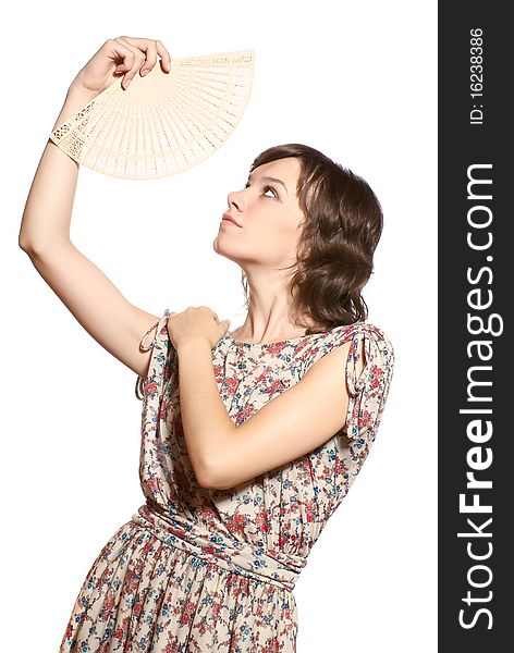 Portrait of a woman with fan. White background. studio shot.