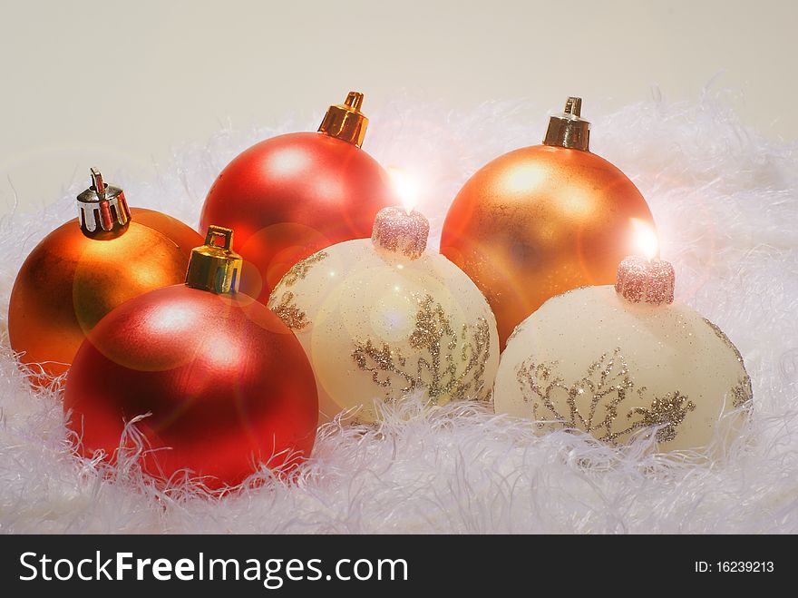 Christmas white candles and red spheres