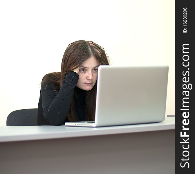 Young business woman work on laptop in office