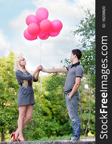 Young loving couple on natural background. Young loving couple on natural background