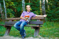 Handsome Guy With Bouquet Waiting For His Girlfrie Royalty Free Stock Photography Handsome Guy With Bouquet Waiting For His Girlfrie Royalty Free Stock Photography