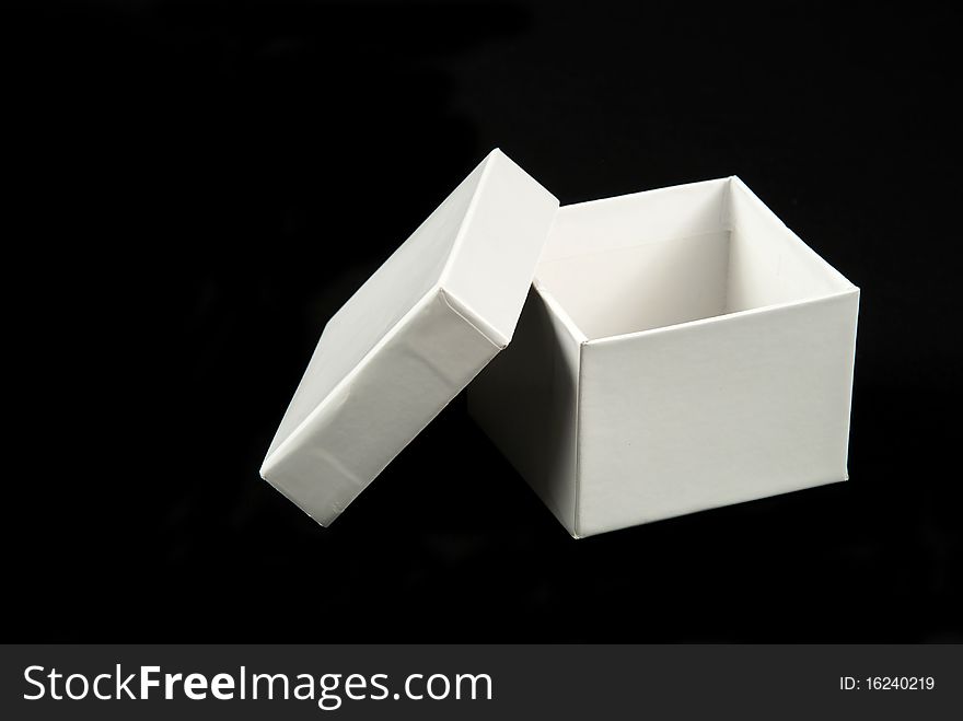Pictures of a square and white cardboard box