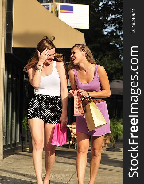 Happy women with shopping bags