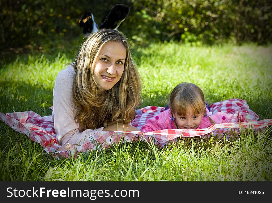 A little girl with her mother in the garden