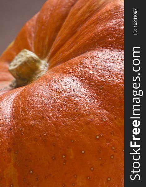 Close-up view of Pumpkin on brown background. Natural. Soft focus.