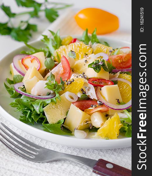 Fresh garden salad with a fork  on plate. Fresh garden salad with a fork  on plate