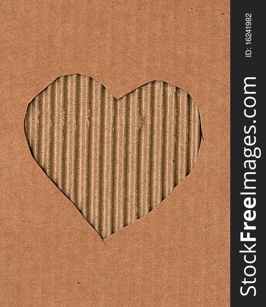 A heart is intagliated from a cardboard. A heart is intagliated from a cardboard