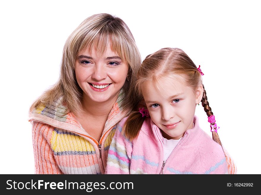 Happy family. Mother and little daughter are smiling . Woman and girl are hugging and posing happily on white background. Happy family. Mother and little daughter are smiling . Woman and girl are hugging and posing happily on white background
