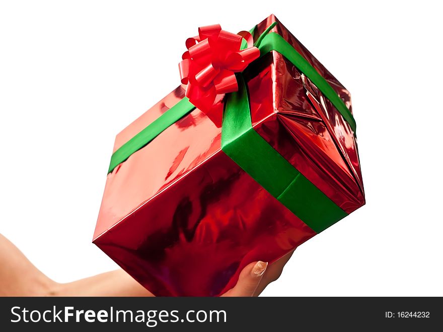 Female hands giving a christmas gift. Isolated on white. Female hands giving a christmas gift. Isolated on white