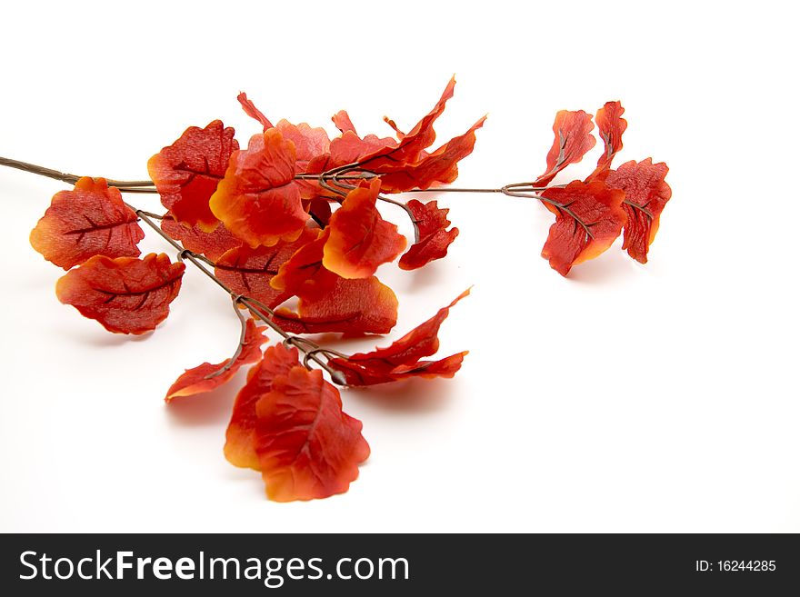 Artificial branch with red leaves