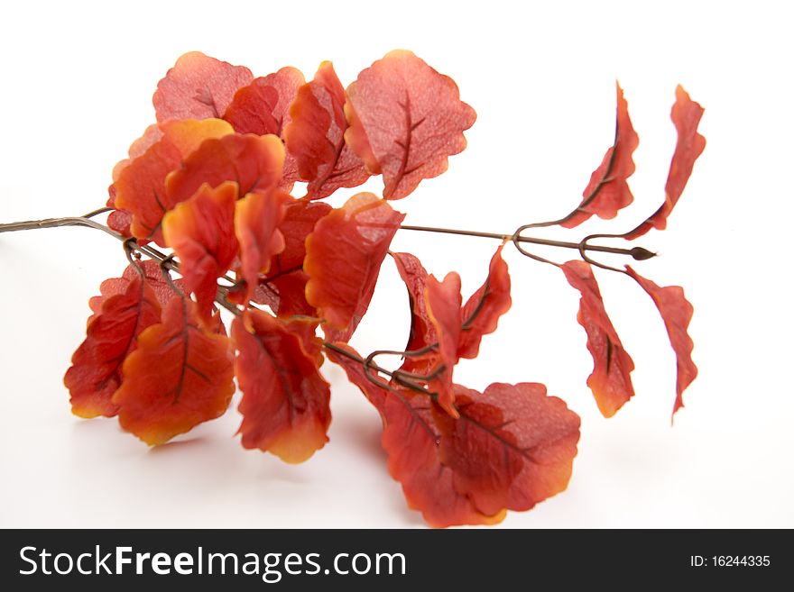 Artificial branch with red leaves