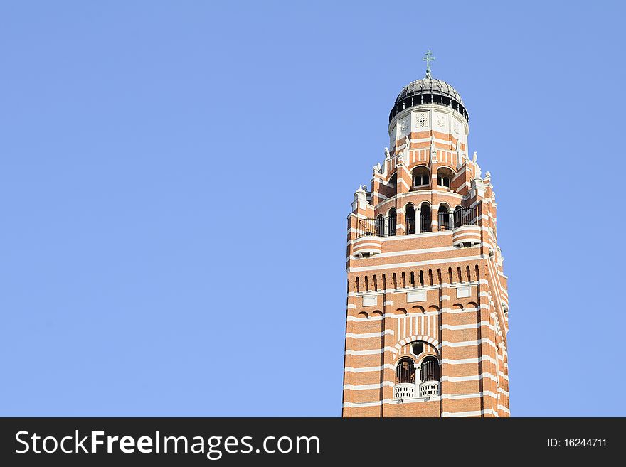 Church tower against blue sky